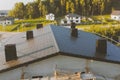 dark gray roof of an industrial building made of metal. Corrugat