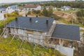 dark gray roof of an industrial building made of metal. Corrugat