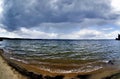 Dark gray sky over the lake before the storm, fish-eye Royalty Free Stock Photo