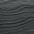 Dark gray slate rock texture with distinct horizontal layers, characterized by fine grain Royalty Free Stock Photo