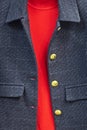 dark gray tweed jacket with gold buttons and red knitted sweater, vertical