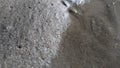 Dark gray wet sand hd quality background in close up photo.