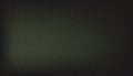 Dark green abstract grainy background with subtle light source creating a moody and textured visual Royalty Free Stock Photo