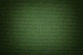 Dark green background from a textile material. Fabric with natural texture. Backdrop Royalty Free Stock Photo