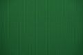 Dark green colored colored corrugated cardboard texture useful as a background Royalty Free Stock Photo