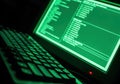Dark Green Computer Screen Displaying Code with Keyboard in Low Light Royalty Free Stock Photo