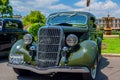 Dark green Ford hot rod car