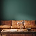 Dark green home interior with old retro leather sofa, table and decor in living room Royalty Free Stock Photo