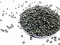 Dark green masterbatch granules Royalty Free Stock Photo