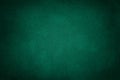 Dark green matt suede fabric closeup. Velvet texture