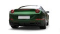 Dark green metallic fast sports car - back view - studio shot Royalty Free Stock Photo