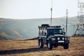 Dark green off-road car in the mountains Royalty Free Stock Photo