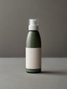 A dark green pump bottle with a white label sits on a gray surface in front of a gray background.