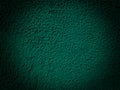 Dark green saturated background with concrete wall texture.