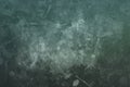 Dark green splattered grungy background or texture