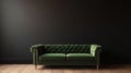 Dark Green Velvet Sofa Against Black Wall Royalty Free Stock Photo