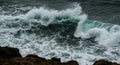 Dark Green Waves Crashing on Rocky Coast Royalty Free Stock Photo