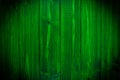 Dark green wood. Natural texture background. Vignette and dark shadow effect. Royalty Free Stock Photo