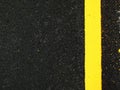 Dark grey asphalt background with yellow line