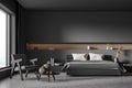 Dark grey bedroom with one armchair and illuminated niche in the wall