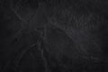 Dark grey black slate texture in natural pattern. Black stone wall. Royalty Free Stock Photo