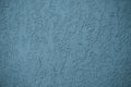 Dark grey and blue stucco surface. Concrete wall. Abstract pattern, embossed background. Texture of paint on grooved plaster. Pape