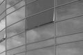 Dark grey glass reflects cloudy sky modern building facade exterior office texture background Royalty Free Stock Photo