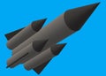 A dark grey long range rocket missile with black warhead blue backdrop Royalty Free Stock Photo