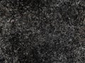 Dark grey natural raw seamless granite stone texture pattern background. Rough natural stone seamless texture surface with cracks, Royalty Free Stock Photo