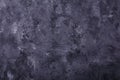 Dark grey painted wooden background with white smears, texture, abstract backdrop, copy space