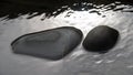 Dark grey rocks in a pool on a beach. Abstract nature background. Royalty Free Stock Photo