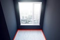 Dark grey room with red plinth