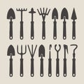 Dark grey silhouette vector set of gardening and construction tools on beige background gardening tools Royalty Free Stock Photo
