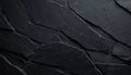 Dark grey slate stone wall texture with deep cracks and sharp angular rock formations Royalty Free Stock Photo