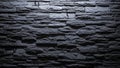 Dark Grey Stacked Stone Wall Texture with Dramatic Lighting and Deep Shadows Creating a Rugged Surface Background Royalty Free Stock Photo