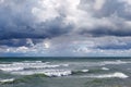 Dark, grey storm clouds over a stormy sea. Royalty Free Stock Photo