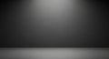 Dark grey studio background with subtle texture and spotlight effect on the wall and floor Royalty Free Stock Photo