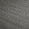Dark grey textured surface with subtle horizontal streaks. The pattern appears smooth Royalty Free Stock Photo