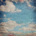 Dark Grunge Background image of a Blue Sky with Clouds painted on a Brick wall Royalty Free Stock Photo