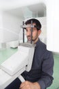 Dark hair man with beard waiting for an x-ray of his teeth. Royalty Free Stock Photo