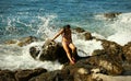 Dark Hair Woman is Sitting on Rocks in Water Rush Royalty Free Stock Photo