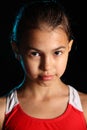 Dark-haired brown-eyed teenage girl posing in a black aqua-zone.