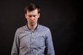 A dark haired white man with distrust expression face Royalty Free Stock Photo