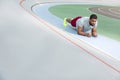 Dark-haired young sportsman doing a forearm plank exercise