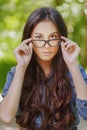 Dark-haired young woman in glasses Royalty Free Stock Photo