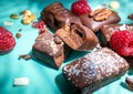 Dark handmade chocolate stack, coconut chips, raspberries and nuts