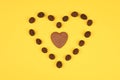 Dark heart on a yellow background. Close Empty space for text or logo. floral background. heart on yellow