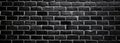 Dark, high-contrast, brick-textured, light-effect black brick wall Royalty Free Stock Photo