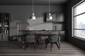 Dark home kitchen interior with eating and cooking area, panoramic window Royalty Free Stock Photo