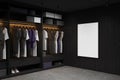 Dark home wardrobe interior clothes hanging on rail, mock up frame Royalty Free Stock Photo
